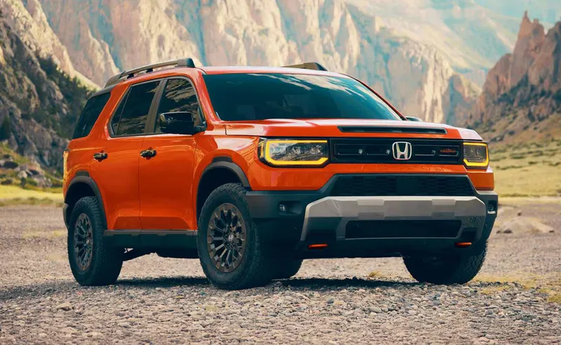 Orange 2026 Honda Passport, repaired to Honda factory procedures at St. Aubin Auto Body